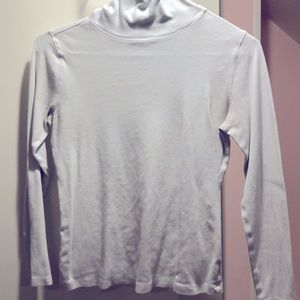 Simple, white, long-sleeve turtleneck.